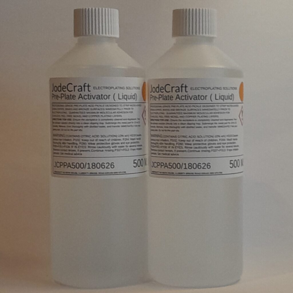 A pair of 500 ml bottles containing a clear Pre-Plate Activator Solution